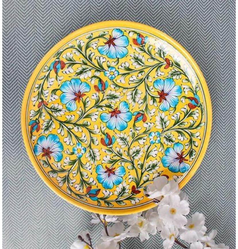  Jaipur blue pottery decorative wall plate with yellow and blue floral patterns. 